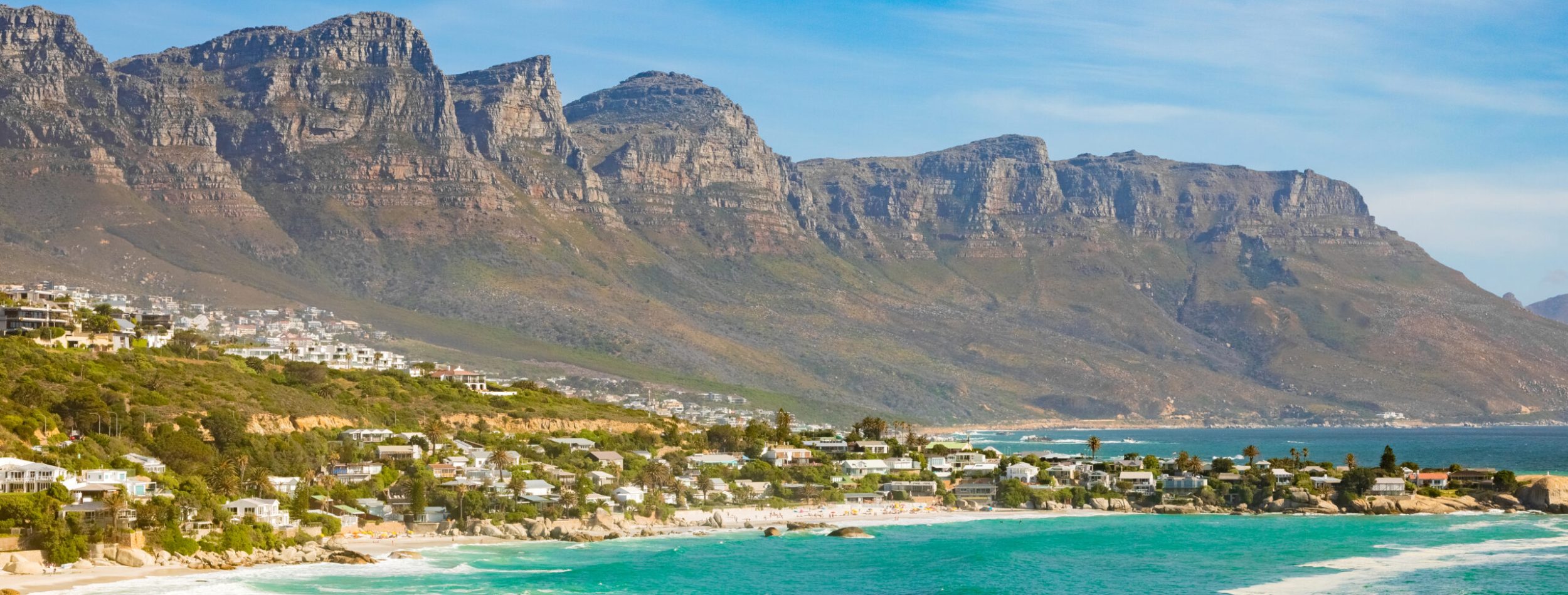 The breathtaking view of the rocky cliffs by the ocean captured in Cape Town, South Africa